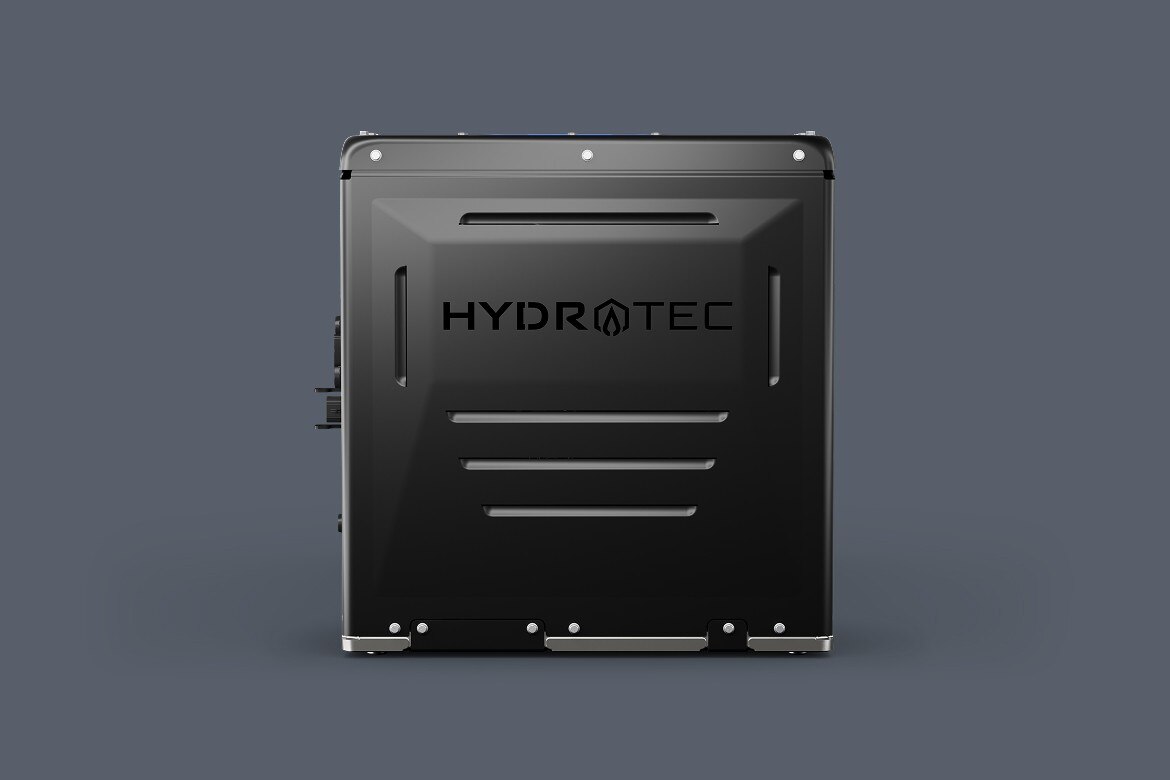 Front view of a hydrogen fuel cell power cube, featuring a matte black exterior with the HYDROTEC logo centered on the panel.